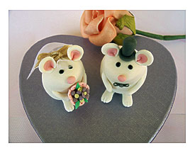 Instead, See The Fun, Cute Cake Toppers Below From Real Weddings That