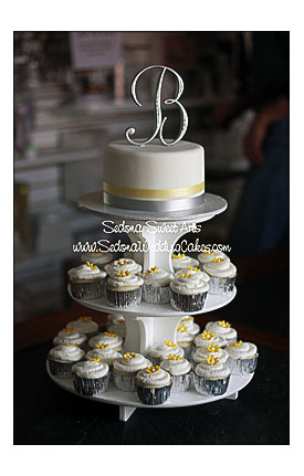 Classic. This Cupcake Tower Adorned With A Single Tier Fondant Cake