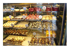 Cupcake Display Filled With A Wide Wide Wide Range Of Cupcake Flavors