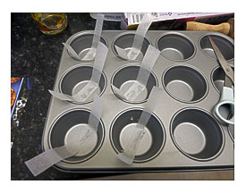 Line 6 Holes In A Deep Muffin Tin With Strips Of Baking Parchment