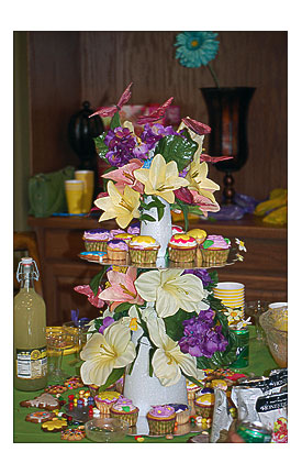 Birthday cupcakes and flower stand.