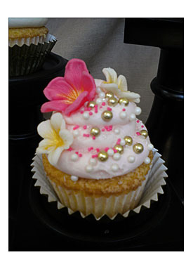 Flowers And Sprinkles, And Also Pink And Purple Bows Pictured