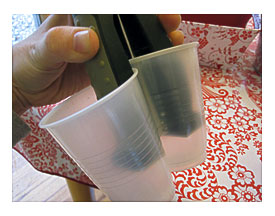 Take Two Cups And Staple Them Together At Least Halfway Down The Cup
