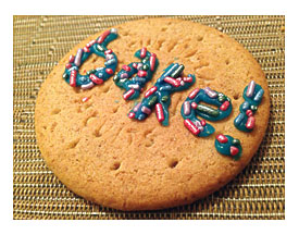 Adorned With Sugar Sprinkles Using Silver Spoon Blue Writing Icing